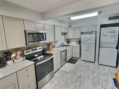PRICED TO SELL! Cozy, Renovated and TURN KEY LOWER unit with on Country Club At Silver Springs Shores in Florida - for sale on GolfHomes.com, golf home, golf lot