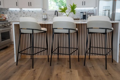 This NEW CONSTRUCTION HOME is furnished, available NOW and ready on Signal Hill Golf Course, Inc. in Florida - for sale on GolfHomes.com, golf home, golf lot