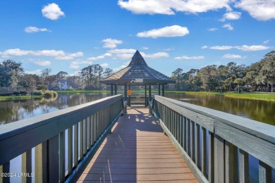 Experience coastal living in this luxurious 2BD/2BA Evian Villa on Shipyard Golf Club in South Carolina - for sale on GolfHomes.com, golf home, golf lot