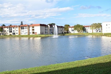 This first floor corner unit is facing the largest lake in on Sunrise Lakes Phase III in Florida - for sale on GolfHomes.com, golf home, golf lot