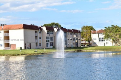 This first floor corner unit is facing the largest lake in on Sunrise Lakes Phase III in Florida - for sale on GolfHomes.com, golf home, golf lot