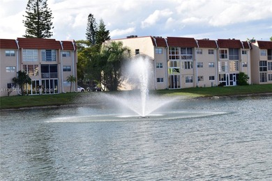 This first floor corner unit is facing the largest lake in on Sunrise Lakes Phase III in Florida - for sale on GolfHomes.com, golf home, golf lot