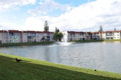 This first floor corner unit is facing the largest lake in on Sunrise Lakes Phase III in Florida - for sale on GolfHomes.com, golf home, golf lot
