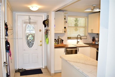 This first floor corner unit is facing the largest lake in on Sunrise Lakes Phase III in Florida - for sale on GolfHomes.com, golf home, golf lot