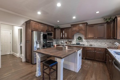 Experience refined living at 1041 Windermere Crossing an elegant on Windermere Golf Club in Georgia - for sale on GolfHomes.com, golf home, golf lot