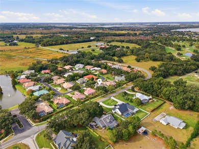 Gated custom home in the Gates of Lake Region! This quiet and on Lake Region Yacht Country Club in Florida - for sale on GolfHomes.com, golf home, golf lot