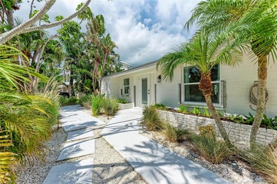 Discover Mia Bella -- a rare canal-front estate on Anna Maria on Key Royale Club in Florida - for sale on GolfHomes.com, golf home, golf lot