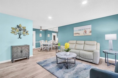 Beautifully updated villa-style condo with an oversized attached on Highland Lakes Executive Golf Course in Florida - for sale on GolfHomes.com, golf home, golf lot