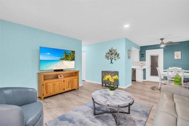 Beautifully updated villa-style condo with an oversized attached on Highland Lakes Executive Golf Course in Florida - for sale on GolfHomes.com, golf home, golf lot