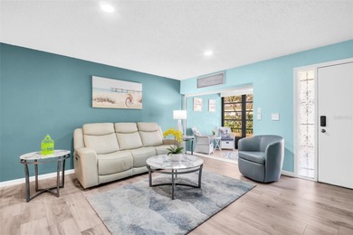 Beautifully updated villa-style condo with an oversized attached on Highland Lakes Executive Golf Course in Florida - for sale on GolfHomes.com, golf home, golf lot