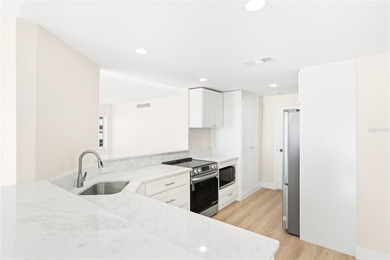 Welcome to Unit 504S, a rare corner residence perched above the on Links on Longboat Golf Club in Florida - for sale on GolfHomes.com, golf home, golf lot