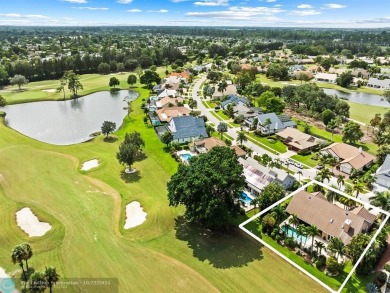 Exceptional home in Boca Woods Country Club combines luxury and on Boca Woods Country Club in Florida - for sale on GolfHomes.com, golf home, golf lot