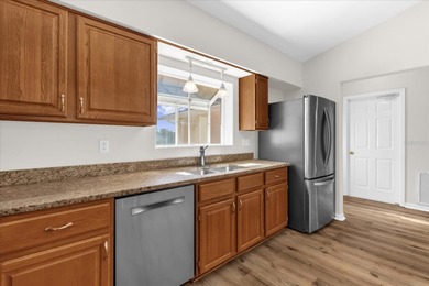 Under contract-accepting backup offers. Charming neighborhood on Green Valley Country Club in Florida - for sale on GolfHomes.com, golf home, golf lot