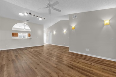 Under contract-accepting backup offers. Charming neighborhood on Green Valley Country Club in Florida - for sale on GolfHomes.com, golf home, golf lot