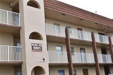 Two-bedroom, two-bathroom corner unit in the second floor in the on Sunrise Lakes Phase III in Florida - for sale on GolfHomes.com, golf home, golf lot