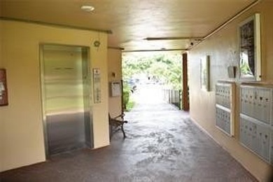 Two-bedroom, two-bathroom corner unit in the second floor in the on Sunrise Lakes Phase III in Florida - for sale on GolfHomes.com, golf home, golf lot