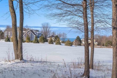 Offering Lake Michigan views, this fully furnished charming on Crooked Tree Golf Club in Michigan - for sale on GolfHomes.com, golf home, golf lot