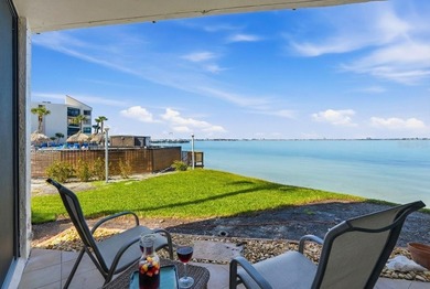 Enjoy sweeping open water views of Boca Ciega Bay from this on Isla Del Sol Yacht and Country Club in Florida - for sale on GolfHomes.com, golf home, golf lot