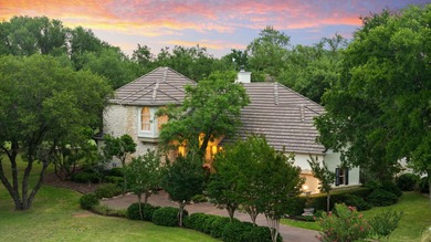 Nestled beneath a canopy of mature trees and overlooking the on Slick Rock Golf Course - Horseshoe Bay in Texas - for sale on GolfHomes.com, golf home, golf lot