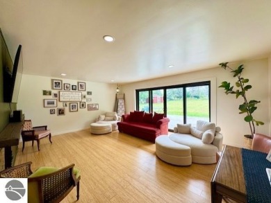 Discover 2,200 sq. ft. of luxurious, single-level living in this on Pine River Country Club in Michigan - for sale on GolfHomes.com, golf home, golf lot