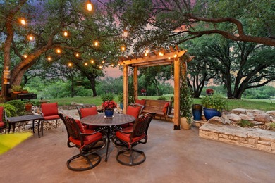 Nestled beneath a canopy of mature trees and overlooking the on Slick Rock Golf Course - Horseshoe Bay in Texas - for sale on GolfHomes.com, golf home, golf lot