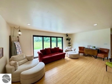 Discover 2,200 sq. ft. of luxurious, single-level living in this on Pine River Country Club in Michigan - for sale on GolfHomes.com, golf home, golf lot