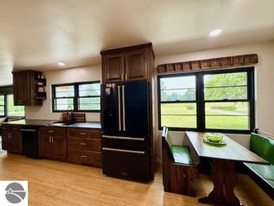 Discover 2,200 sq. ft. of luxurious, single-level living in this on Pine River Country Club in Michigan - for sale on GolfHomes.com, golf home, golf lot