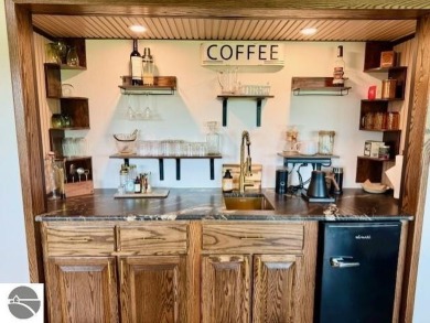 Discover 2,200 sq. ft. of luxurious, single-level living in this on Pine River Country Club in Michigan - for sale on GolfHomes.com, golf home, golf lot