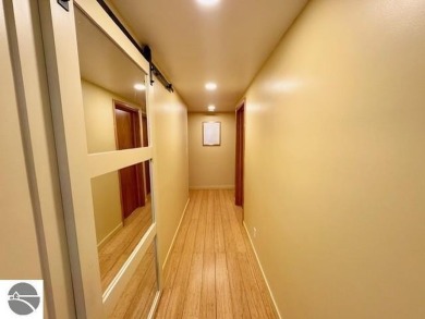 Discover 2,200 sq. ft. of luxurious, single-level living in this on Pine River Country Club in Michigan - for sale on GolfHomes.com, golf home, golf lot