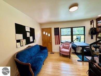Discover 2,200 sq. ft. of luxurious, single-level living in this on Pine River Country Club in Michigan - for sale on GolfHomes.com, golf home, golf lot