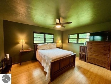 Discover 2,200 sq. ft. of luxurious, single-level living in this on Pine River Country Club in Michigan - for sale on GolfHomes.com, golf home, golf lot