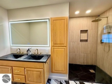 Discover 2,200 sq. ft. of luxurious, single-level living in this on Pine River Country Club in Michigan - for sale on GolfHomes.com, golf home, golf lot