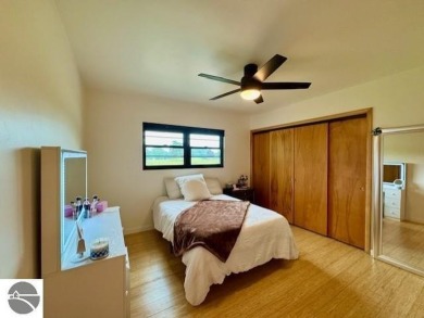 Discover 2,200 sq. ft. of luxurious, single-level living in this on Pine River Country Club in Michigan - for sale on GolfHomes.com, golf home, golf lot
