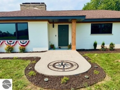 Discover 2,200 sq. ft. of luxurious, single-level living in this on Pine River Country Club in Michigan - for sale on GolfHomes.com, golf home, golf lot