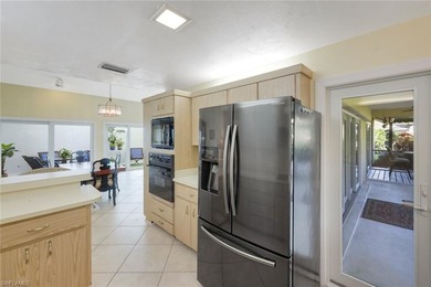 Nestled within the gated community of Spanish Wells in Bonita on Spanish Wells Golf and Country Club in Florida - for sale on GolfHomes.com, golf home, golf lot
