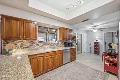 Welcome to this charming single-story home situated on a highly on Briarwood Country Club in Arizona - for sale on GolfHomes.com, golf home, golf lot