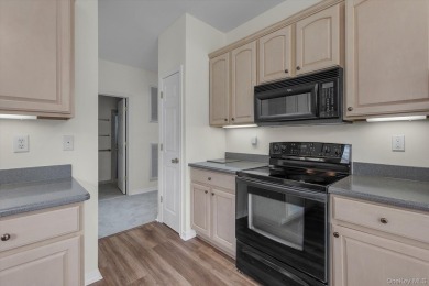 This 2 bedroom end unit ranch home is in a prime location on The Woods At Cherry Creek in New York - for sale on GolfHomes.com, golf home, golf lot