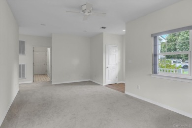 This 2 bedroom end unit ranch home is in a prime location on The Woods At Cherry Creek in New York - for sale on GolfHomes.com, golf home, golf lot