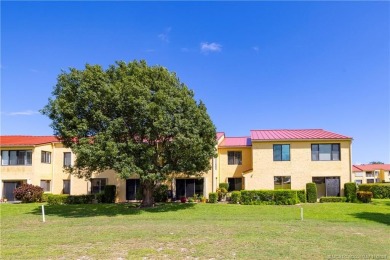 Fresh, sunny, ground-floor 2BR/2BA condo on the 6th fairway of on Miles Grant Country Club in Florida - for sale on GolfHomes.com, golf home, golf lot