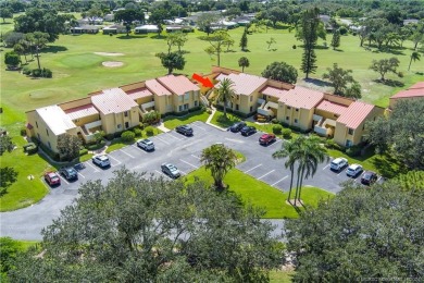 Fresh, sunny, ground-floor 2BR/2BA condo on the 6th fairway of on Miles Grant Country Club in Florida - for sale on GolfHomes.com, golf home, golf lot