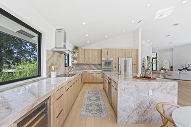 Exquisite, fully upgraded residence nestled within the on Stonebridge Golf and Country Club in Florida - for sale on GolfHomes.com, golf home, golf lot