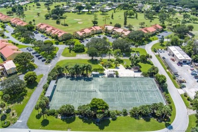 Fresh, sunny, ground-floor 2BR/2BA condo on the 6th fairway of on Miles Grant Country Club in Florida - for sale on GolfHomes.com, golf home, golf lot