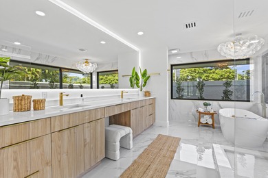 Exquisite, fully upgraded residence nestled within the on Stonebridge Golf and Country Club in Florida - for sale on GolfHomes.com, golf home, golf lot