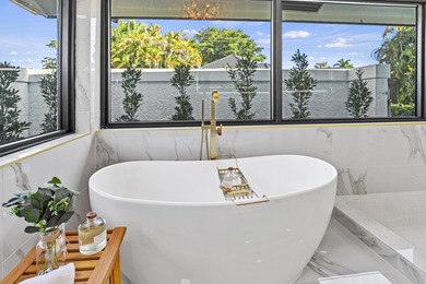 Exquisite, fully upgraded residence nestled within the on Stonebridge Golf and Country Club in Florida - for sale on GolfHomes.com, golf home, golf lot