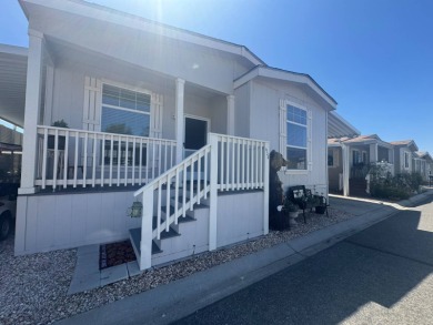 This 2021 model year "pre-owned" home that is on Hemet West Mobile Estates in California - for sale on GolfHomes.com, golf home, golf lot