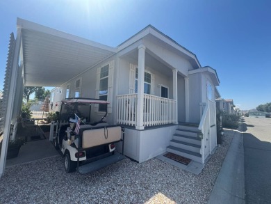 This 2021 model year "pre-owned" home that is on Hemet West Mobile Estates in California - for sale on GolfHomes.com, golf home, golf lot