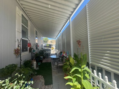 This 2021 model year "pre-owned" home that is on Hemet West Mobile Estates in California - for sale on GolfHomes.com, golf home, golf lot