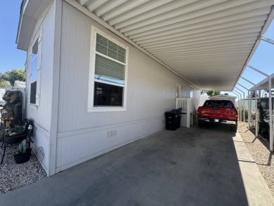 This 2021 model year "pre-owned" home that is on Hemet West Mobile Estates in California - for sale on GolfHomes.com, golf home, golf lot