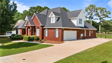 Overlooking the scenic fairways of Saugahatchee Golf Course on Saugahatchee Country Club in Alabama - for sale on GolfHomes.com, golf home, golf lot