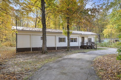 Remodeled in 2024, this 3-bedroom, 1-bath home in Lakes of the on Lakes of the North Deer Run Golf Course in Michigan - for sale on GolfHomes.com, golf home, golf lot